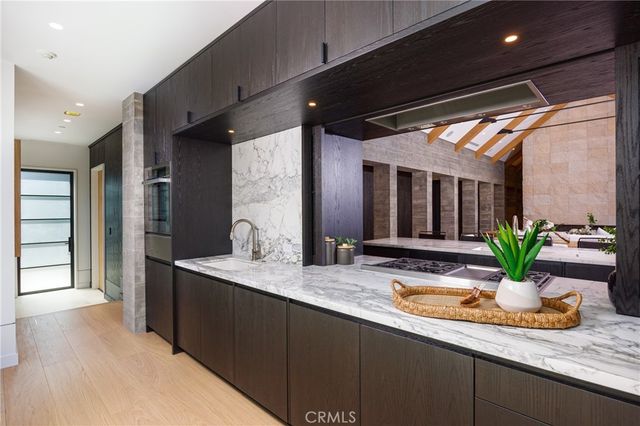 a view of a patio with table and chairs and potted plants