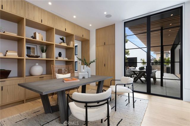 a view of a bedroom with furniture and a fireplace