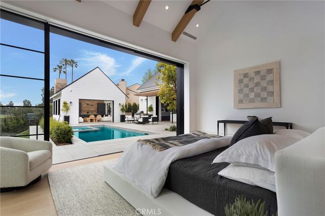 a bathroom with a double vanity sink a mirror and a bathtub