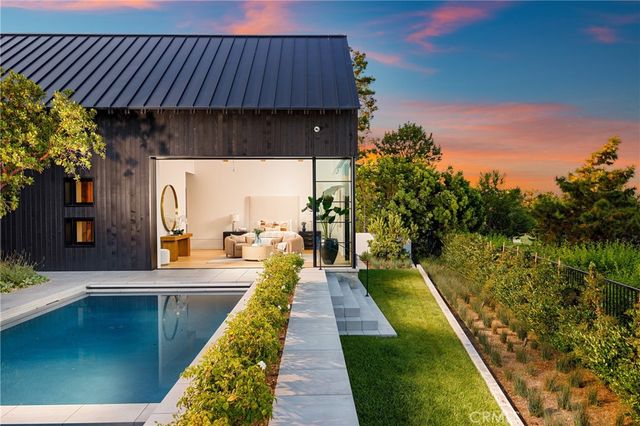 a view of swimming pool with a lounge chair