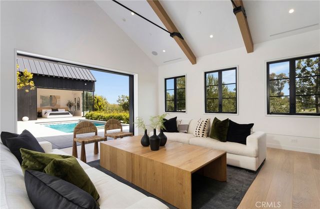 a spacious bedroom with a bed and a large window