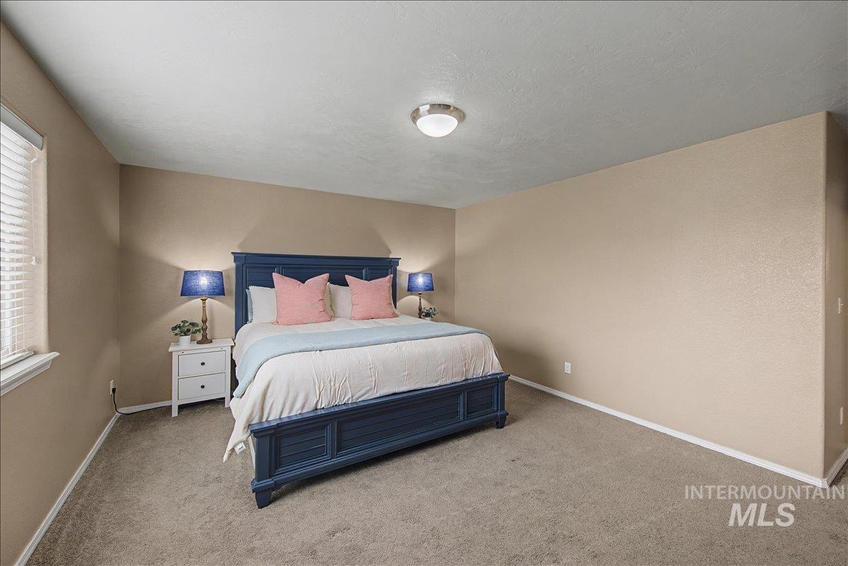 681 West Archerfield Street Meridian, ID 83646 - Photo 20 of 43 Bedroom with carpet flooring and baseboards