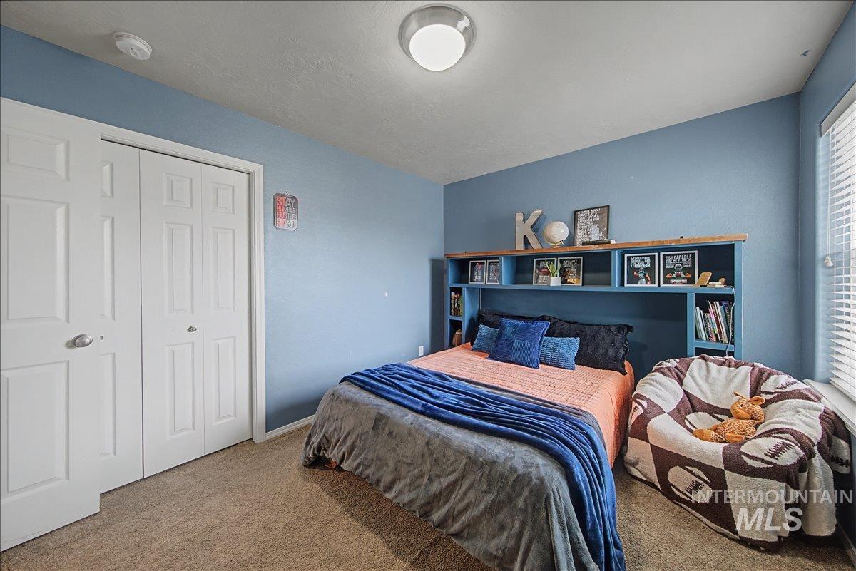 681 West Archerfield Street Meridian, ID 83646 - Photo 37 of 43 Bedroom with carpet flooring and a closet
