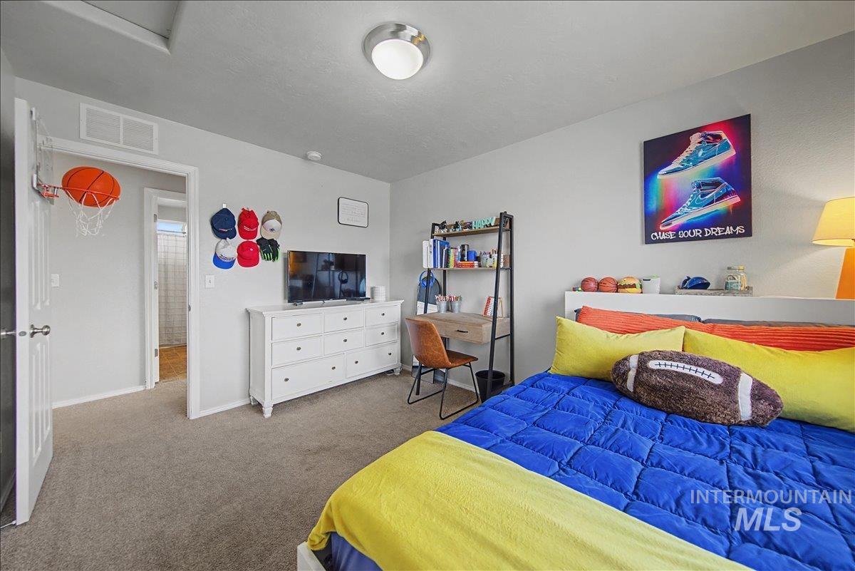681 West Archerfield Street Meridian, ID 83646 - Photo 40 of 43 Carpeted bedroom featuring baseboards