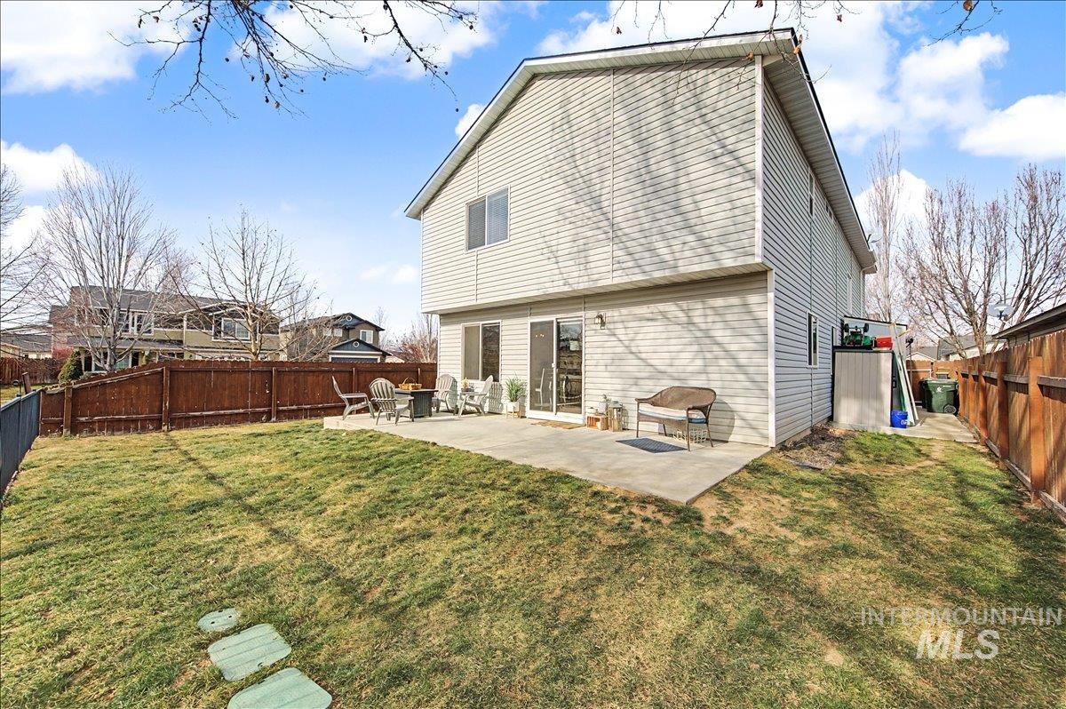 681 West Archerfield Street Meridian, ID 83646 - Photo 42 of 43 Back of house featuring a patio and a fenced backyard