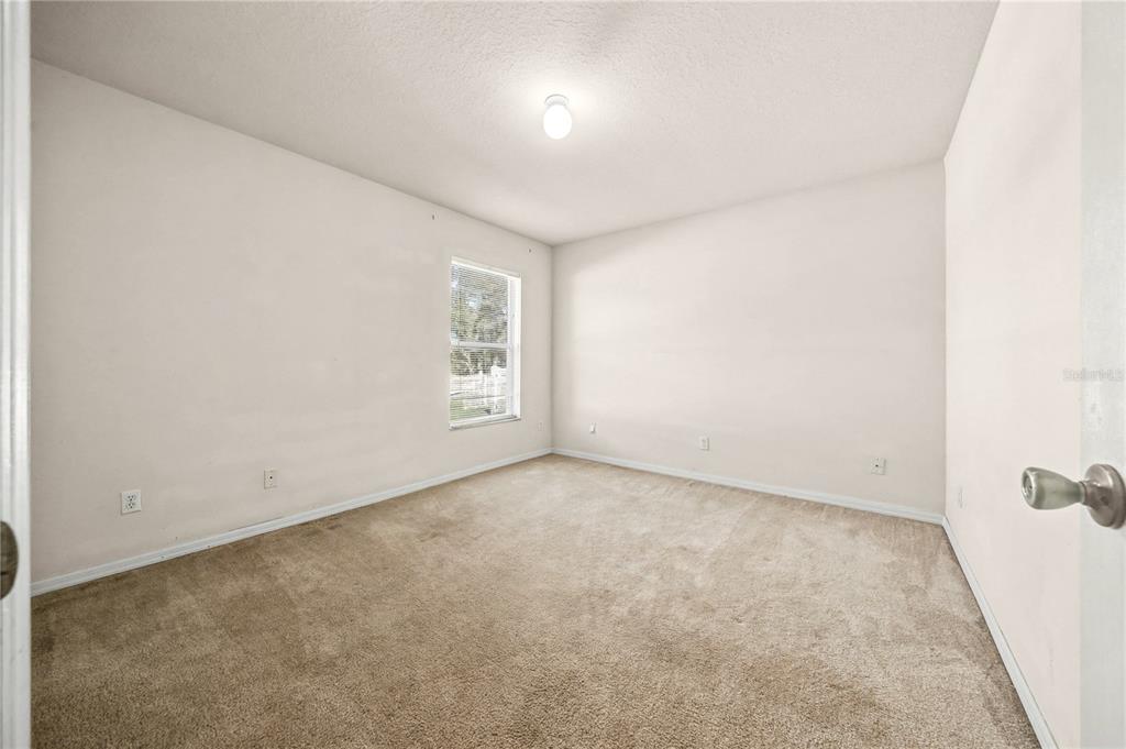 27 Vinca Street Homosassa, FL 34446 - Photo 18 of 50 an empty room with windows