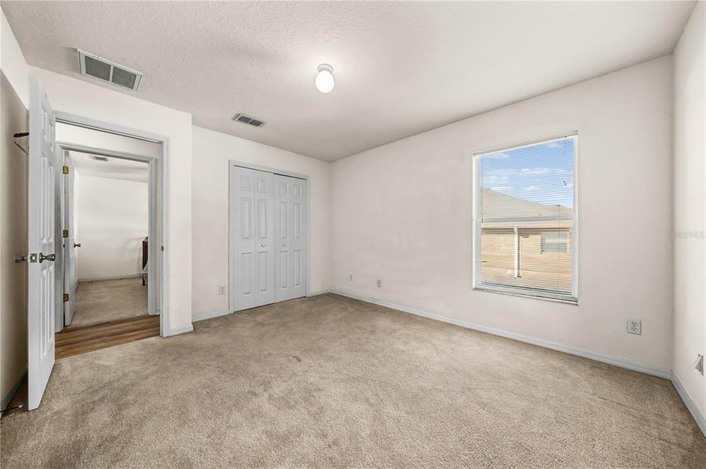 27 Vinca Street Homosassa, FL 34446 - Photo 19 of 50 an empty room with a window and a bathroom