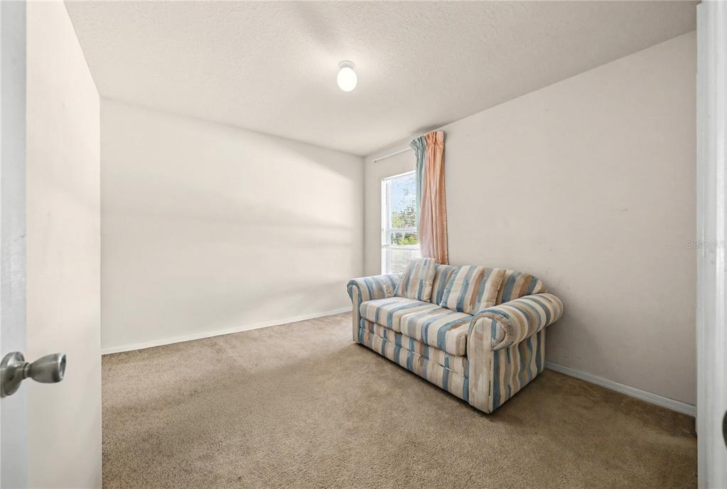 27 Vinca Street Homosassa, FL 34446 - Photo 25 of 50 a living room with furniture and a window