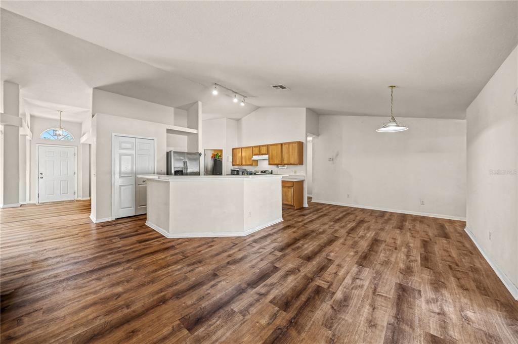 27 Vinca Street Homosassa, FL 34446 - Photo 32 of 50 a view of kitchen with refrigerator and wooden floor
