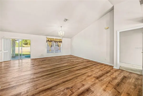 a view of an empty room and window