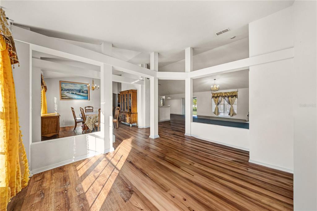 27 Vinca Street Homosassa, FL 34446 - Photo 43 of 50 a view of a big room with wooden floor and windows