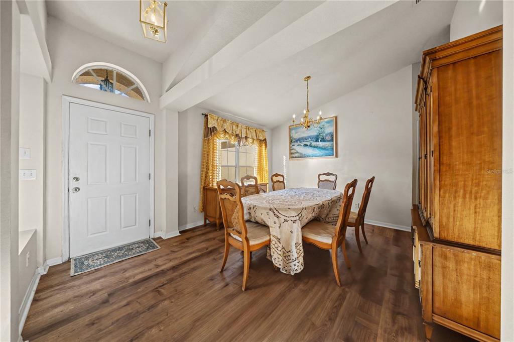 27 Vinca Street Homosassa, FL 34446 - Photo 44 of 50 a view of a dining room with furniture window and wooden floor