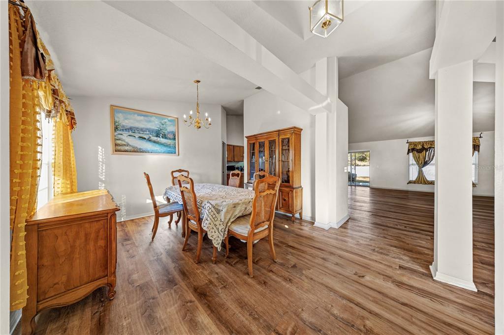 27 Vinca Street Homosassa, FL 34446 - Photo 47 of 50 a view of a dining room with furniture and wooden floor