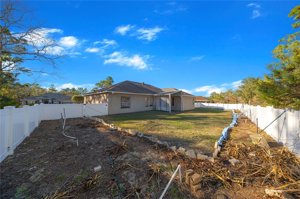 27 Vinca Street Homosassa, FL 34446 - Photo 8 of 50 a view of a house with a yard