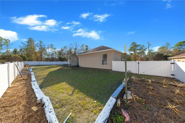 a view of a backyard of the house