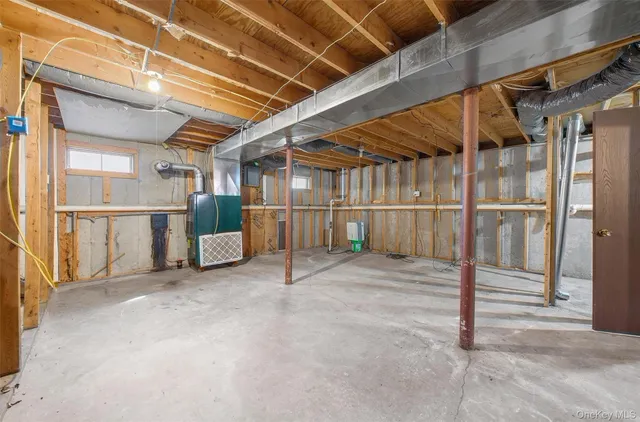 a utility room with shower and mirror