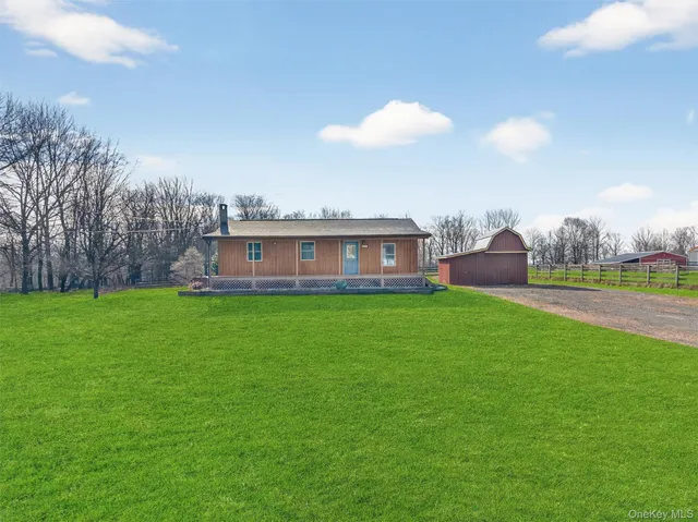 a view of a house with a big yard
