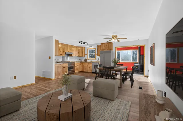 a view of a livingroom with furniture and a table