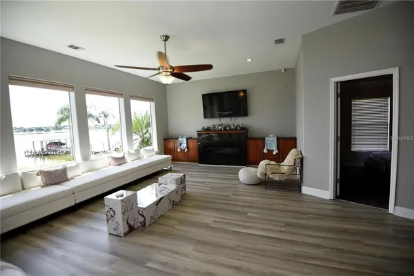 a living room with furniture and a flat screen tv