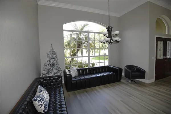 a living room with furniture and a large window