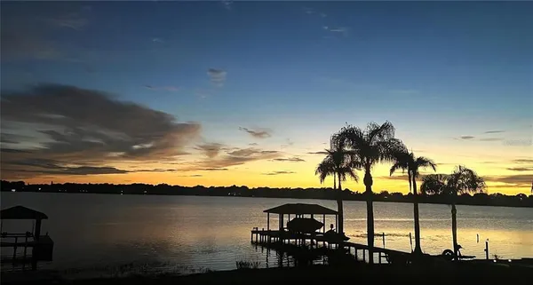 a view of ocean with a mountain