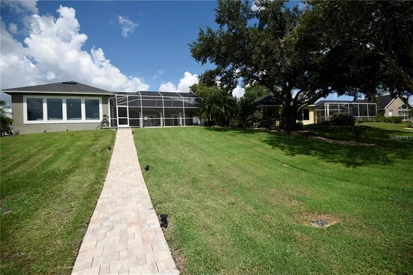 a front view of a house with yard