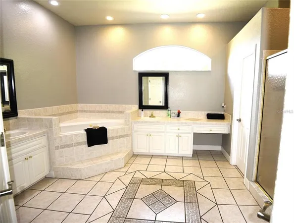 a kitchen with a sink cabinets and appliances