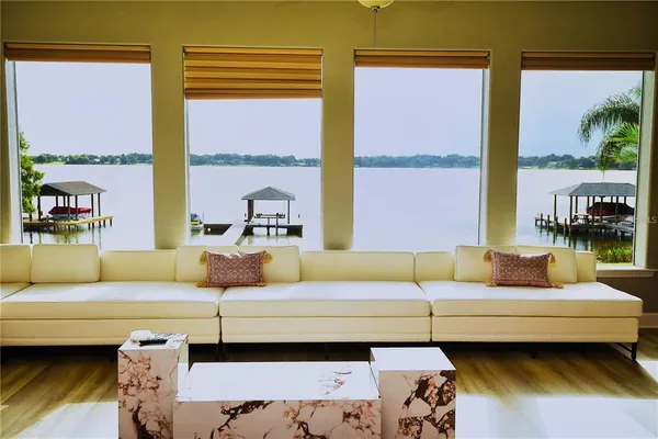 a living room with furniture and a large window