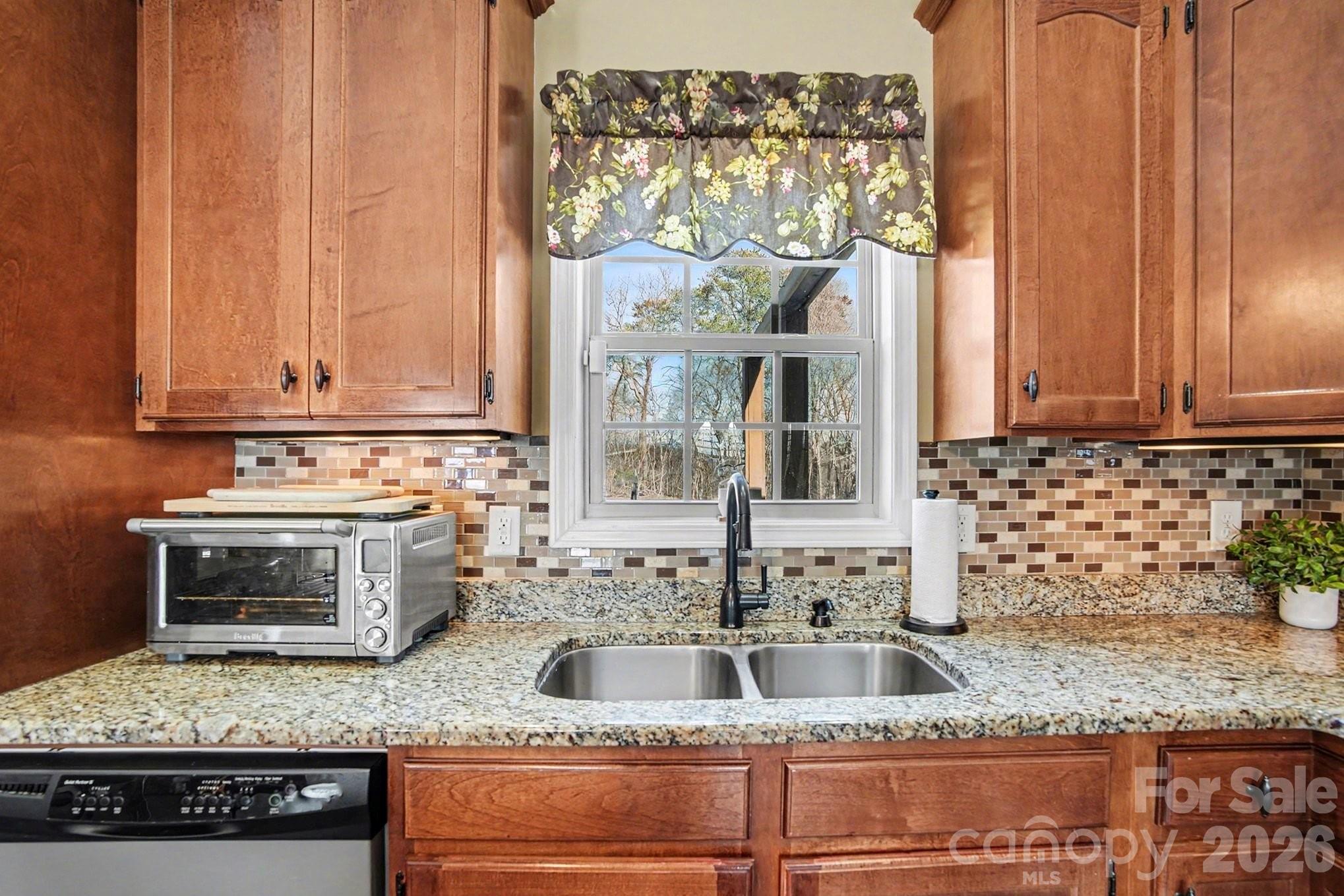 311 Massey Deal Road Statesville, NC 28625 - Photo 16 of 34 a kitchen with granite countertop a sink and a stove
