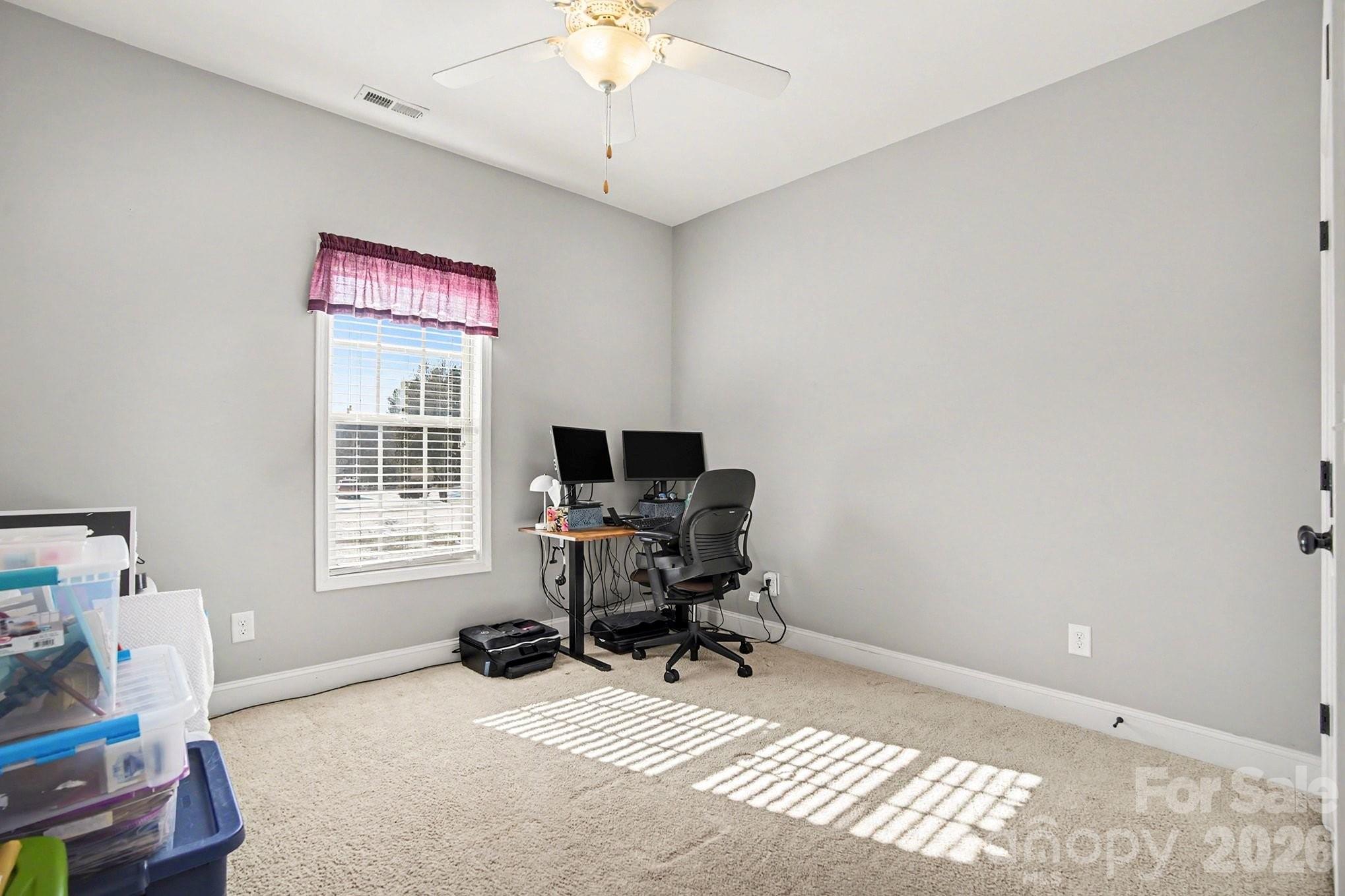 311 Massey Deal Road Statesville, NC 28625 - Photo 17 of 34 a view of a workspace with furniture and a window