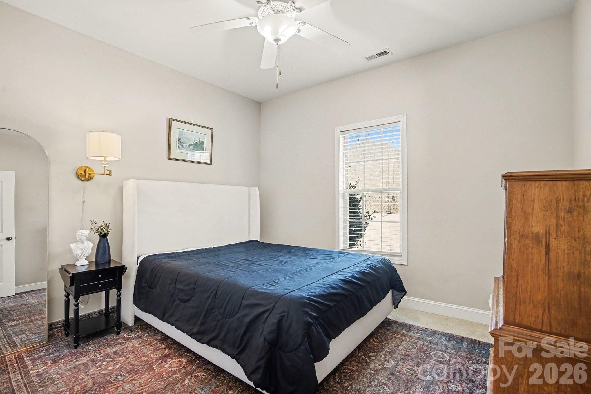 311 Massey Deal Road Statesville, NC 28625 - Photo 18 of 34 a bedroom with a bed and a window