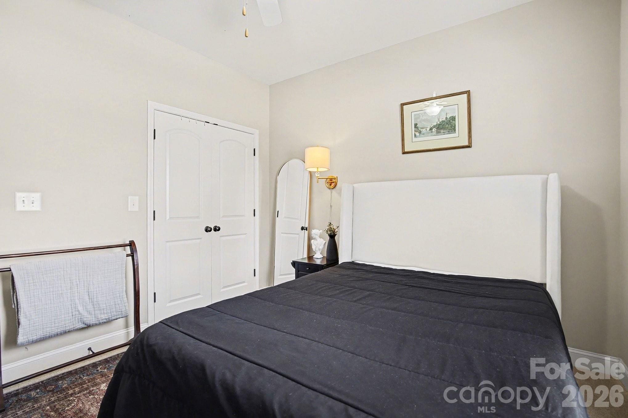 311 Massey Deal Road Statesville, NC 28625 - Photo 22 of 34 a bedroom with a bed and a painting on the wall