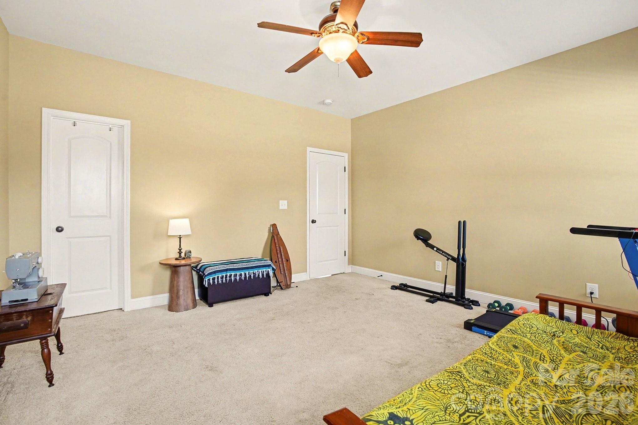311 Massey Deal Road Statesville, NC 28625 - Photo 27 of 34 a bedroom with a bed and wooden floor