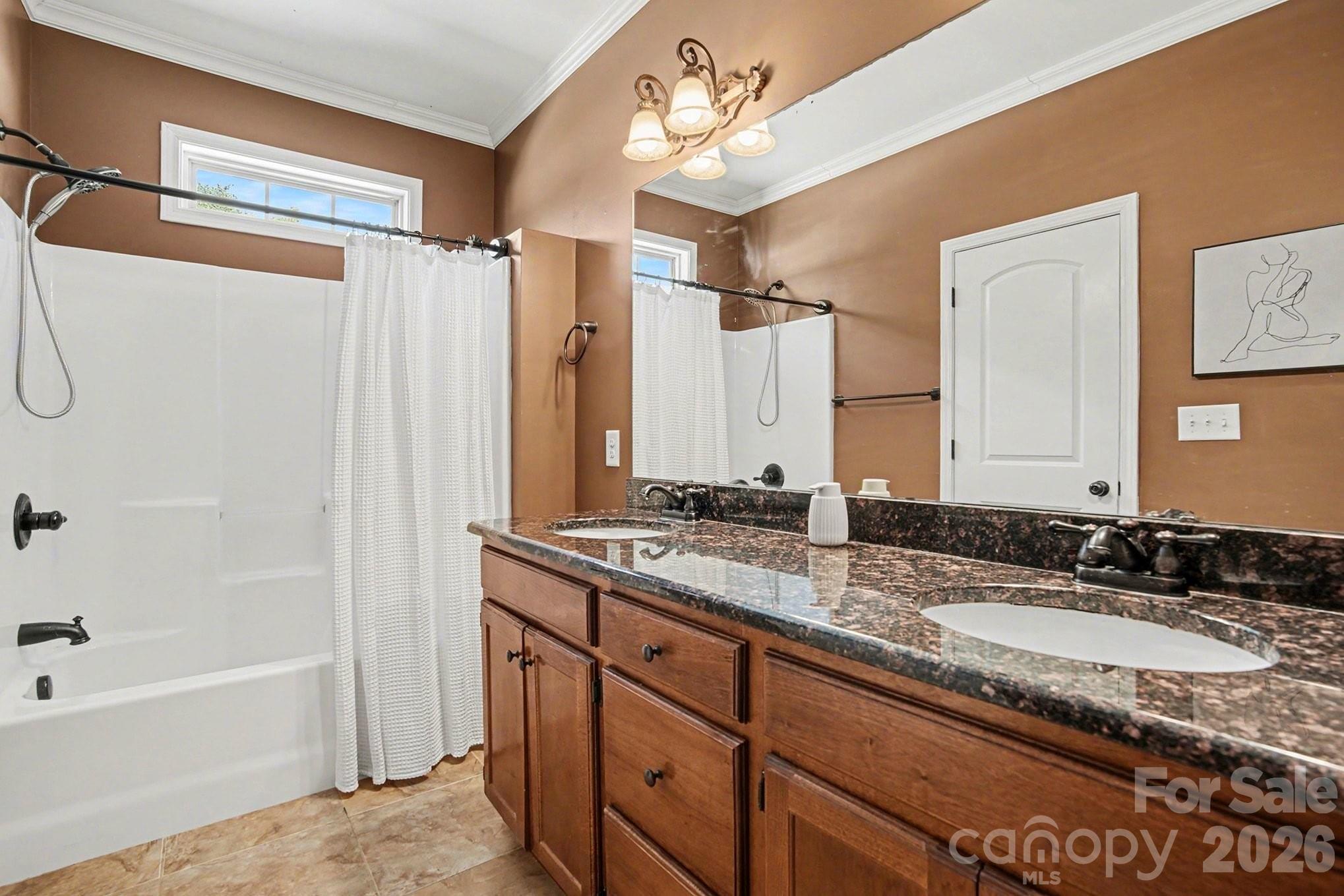 311 Massey Deal Road Statesville, NC 28625 - Photo 28 of 34 a bathroom with a granite countertop sink mirror and a bathtub