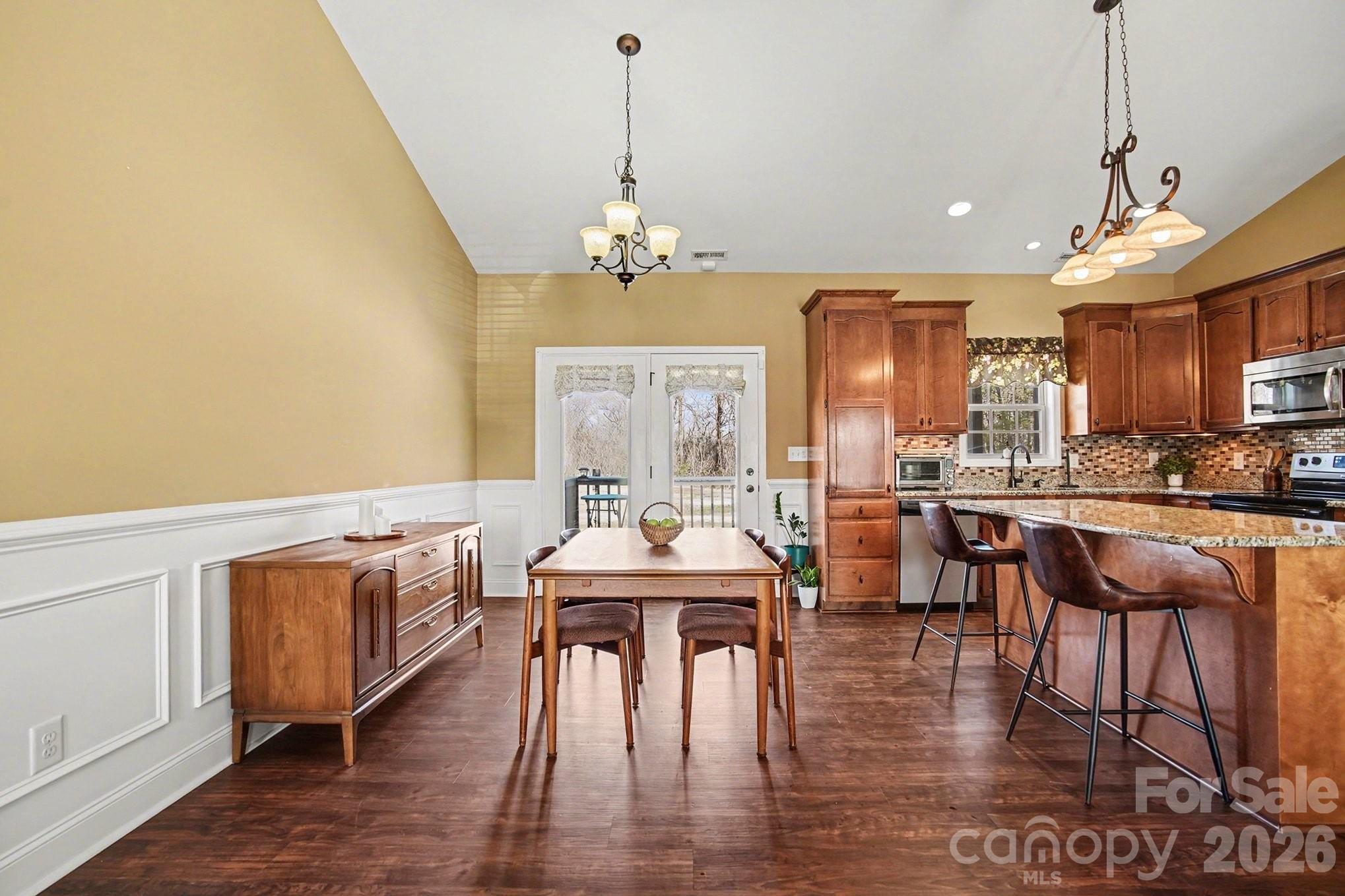 311 Massey Deal Road Statesville, NC 28625 - Photo 8 of 34 a view of a dining room with furniture window and wooden floor