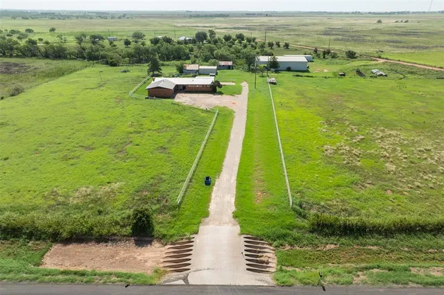 a view of a garden with a building