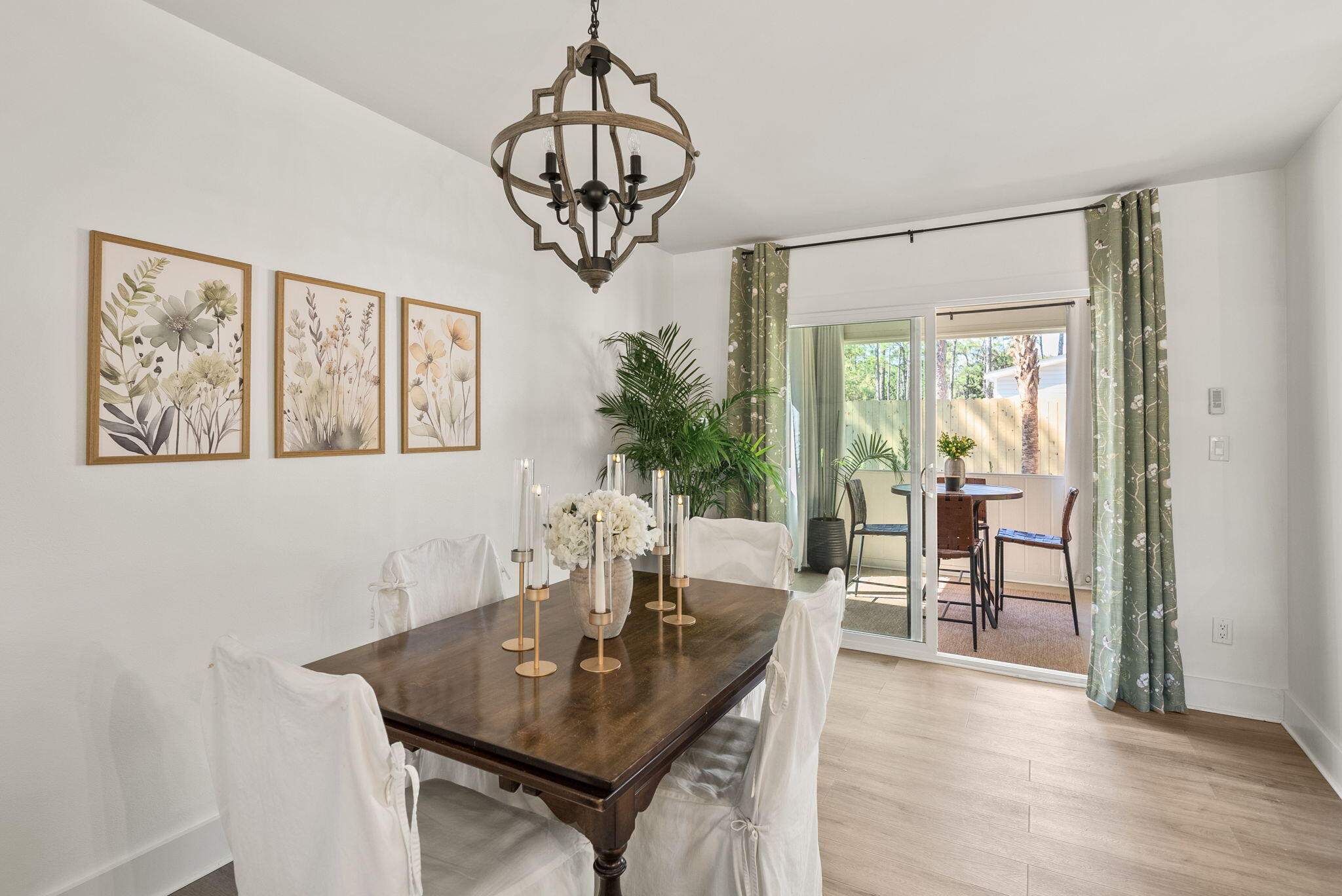 1045 Don Bishop Road Santa Rosa Beach, FL 32459 - Photo 12 of 37 a view of a dining room with furniture window and wooden floor