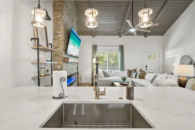 a view of living room with furniture and chandelier