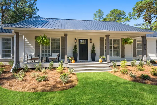 a view of a house with garden and porch