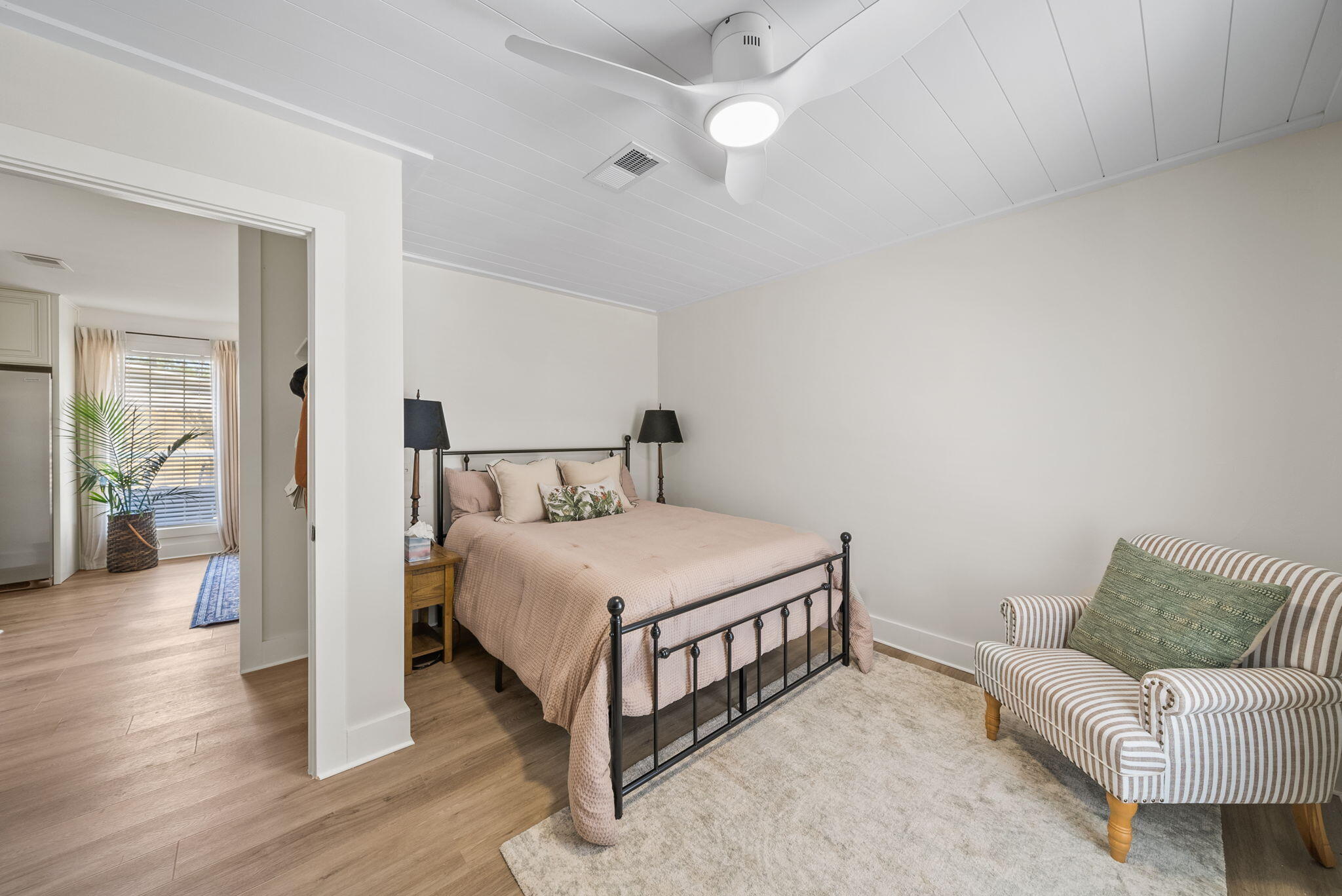 1045 Don Bishop Road Santa Rosa Beach, FL 32459 - Photo 29 of 37 a bedroom with a bed rug and wooden floor