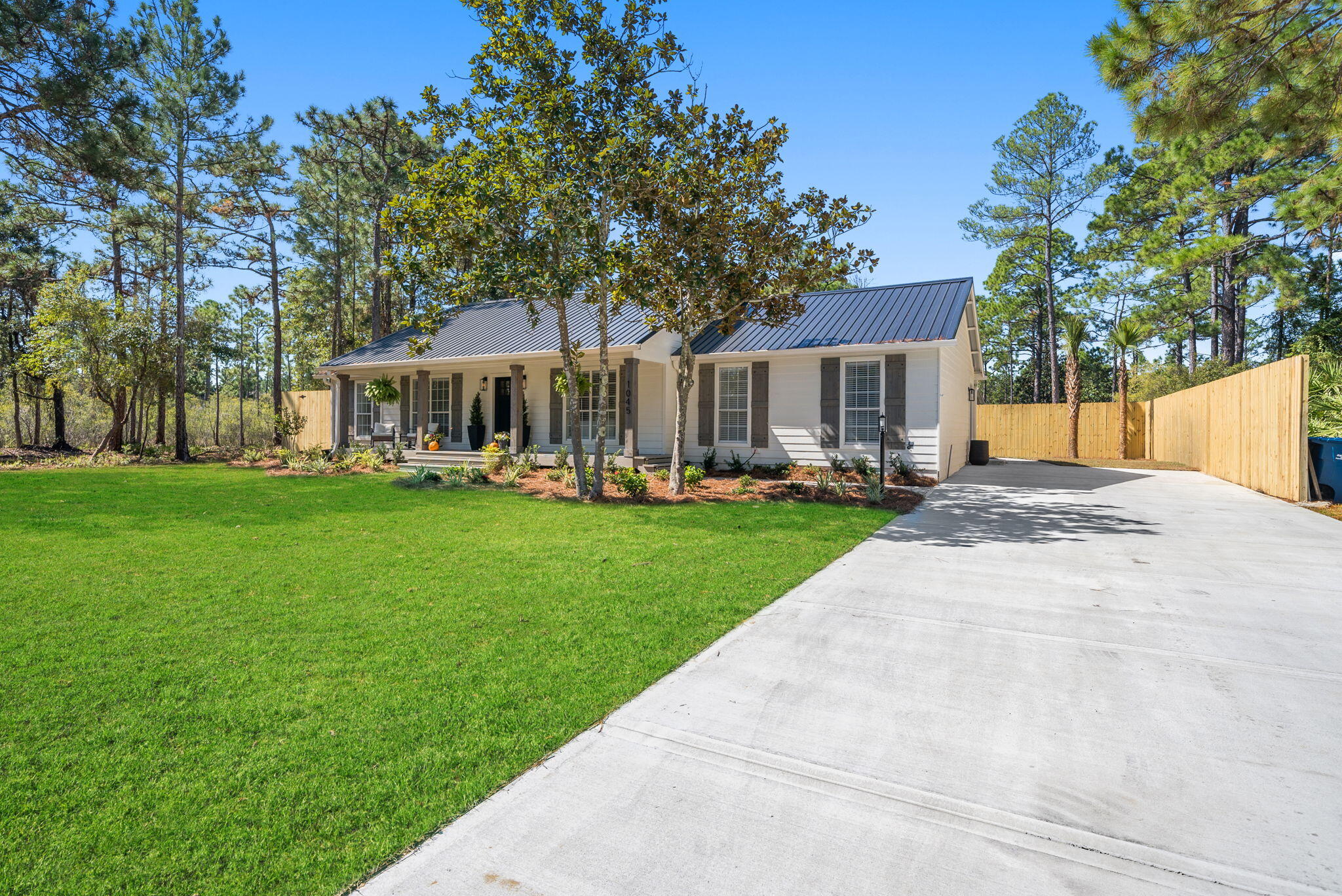 1045 Don Bishop Road Santa Rosa Beach, FL 32459 - Photo 3 of 37 a front view of house with yard