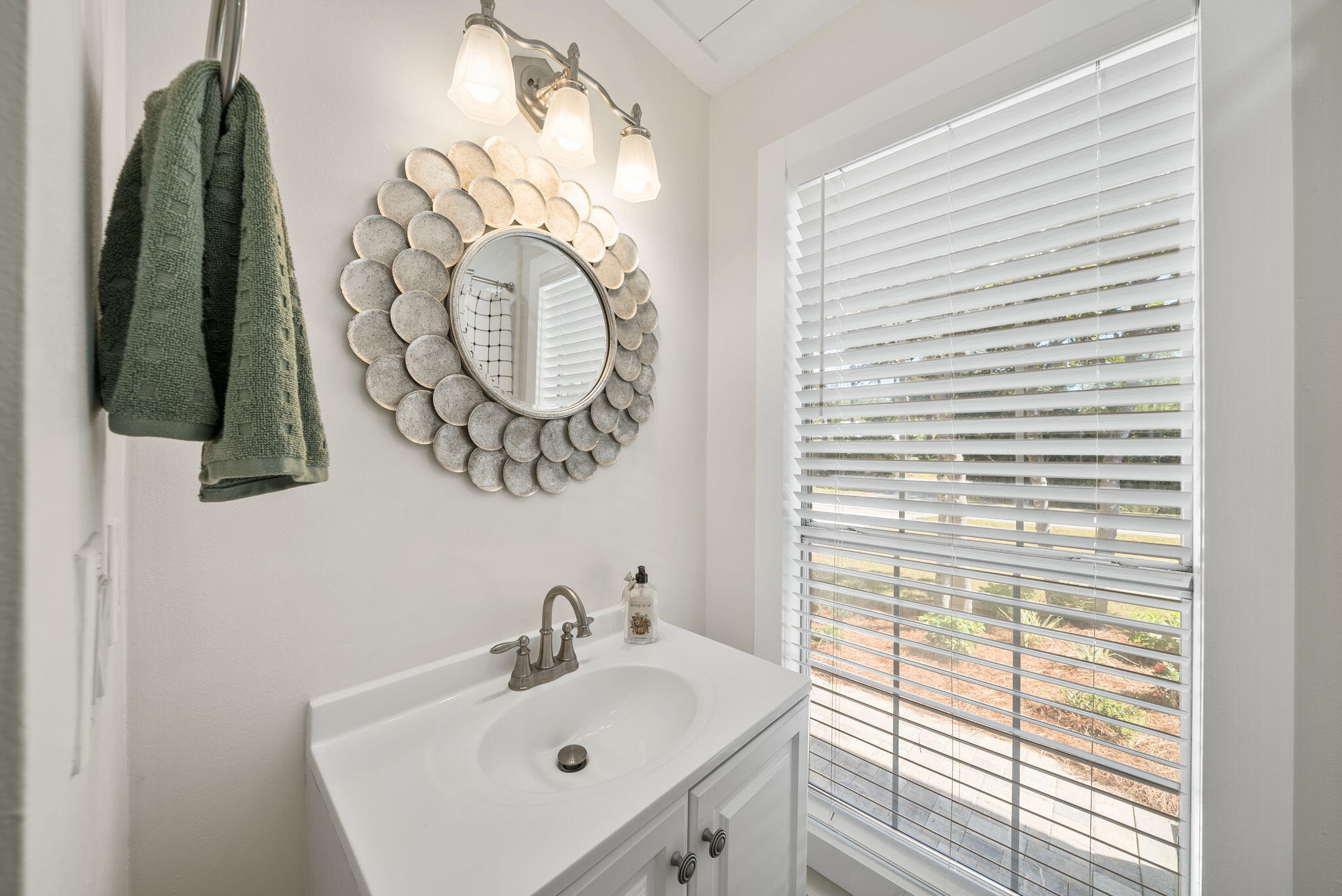 1045 Don Bishop Road Santa Rosa Beach, FL 32459 - Photo 32 of 37 a bathroom with a sink and a mirror