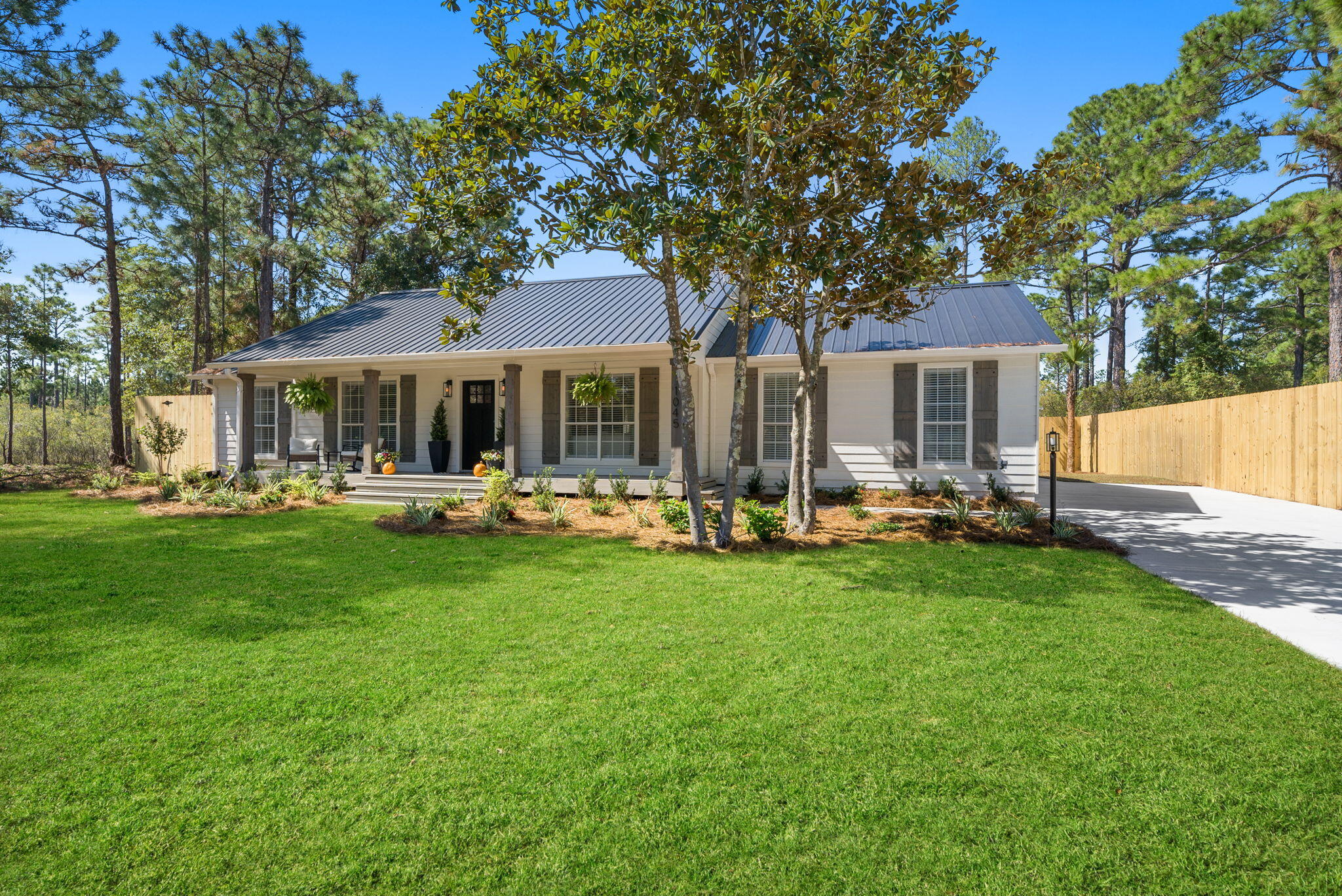1045 Don Bishop Road Santa Rosa Beach, FL 32459 - Photo 4 of 37 a front view of a house with yard and green space