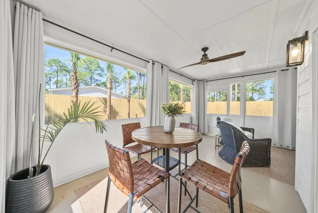 a dining room with furniture and window