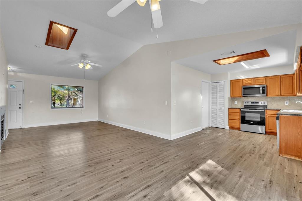 7724 Pengrove Pass Orlando, FL 32835 - Photo 16 of 24 a view of kitchen with microwave and refrigerator