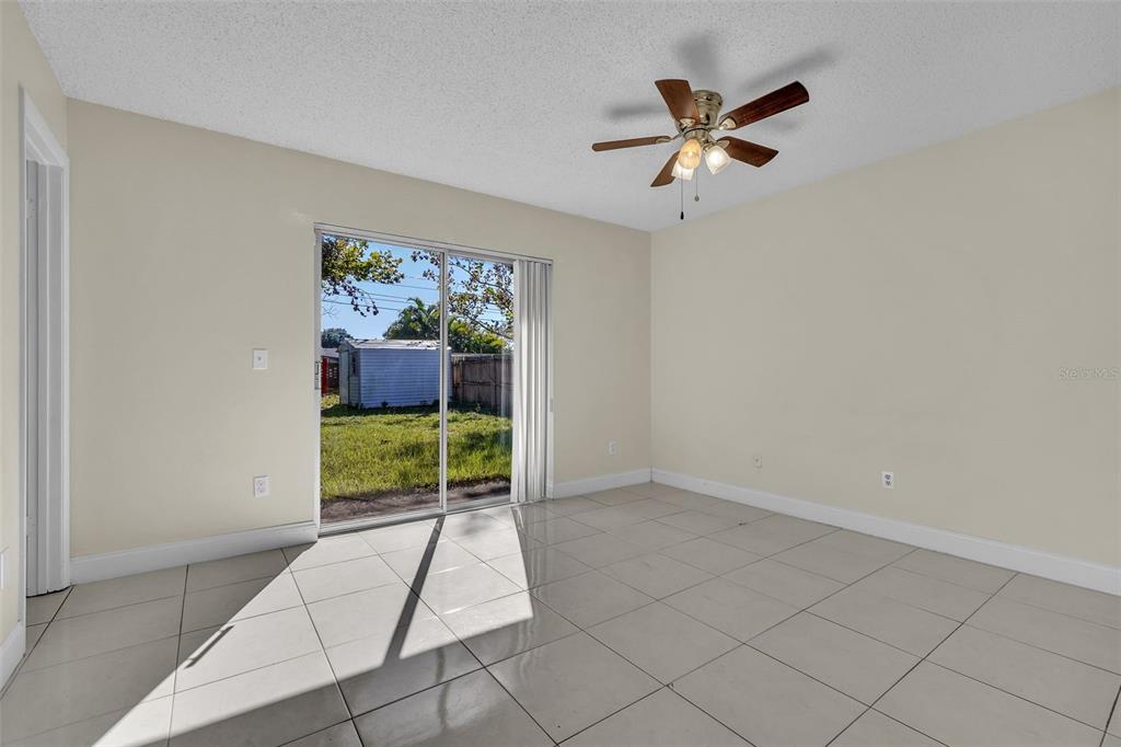 7724 Pengrove Pass Orlando, FL 32835 - Photo 20 of 24 a living room with furniture and a large window