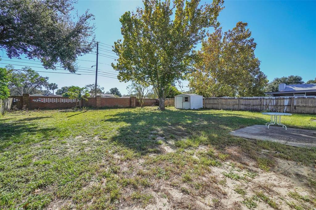 7724 Pengrove Pass Orlando, FL 32835 - Photo 24 of 24 a view of a swimming pool with a yard