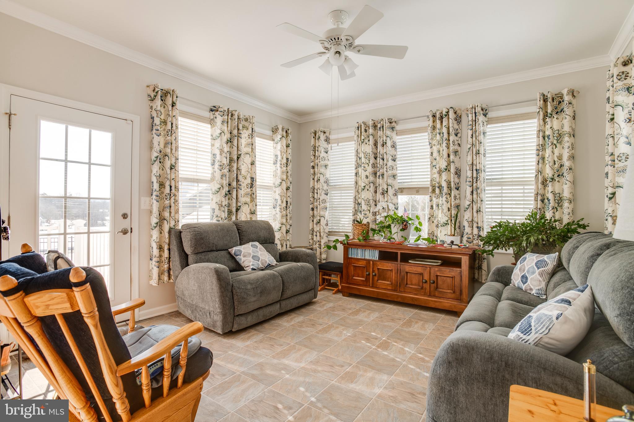 9408 Blackbird Loop Culpeper, VA 22701 - Photo 18 of 89 a living room with furniture and a large window