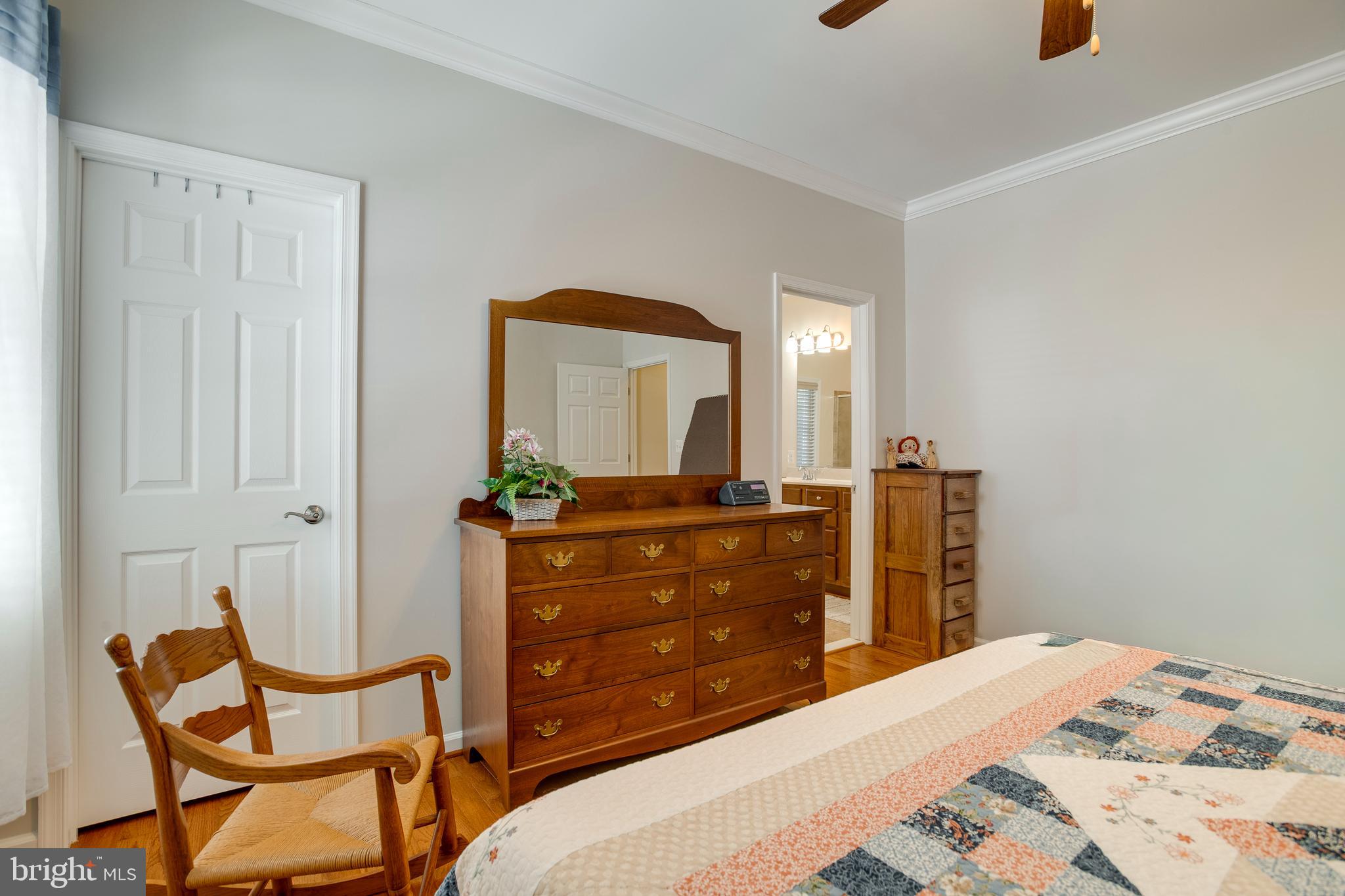 9408 Blackbird Loop Culpeper, VA 22701 - Photo 21 of 89 a bedroom with a bed and a mirror on dresser
