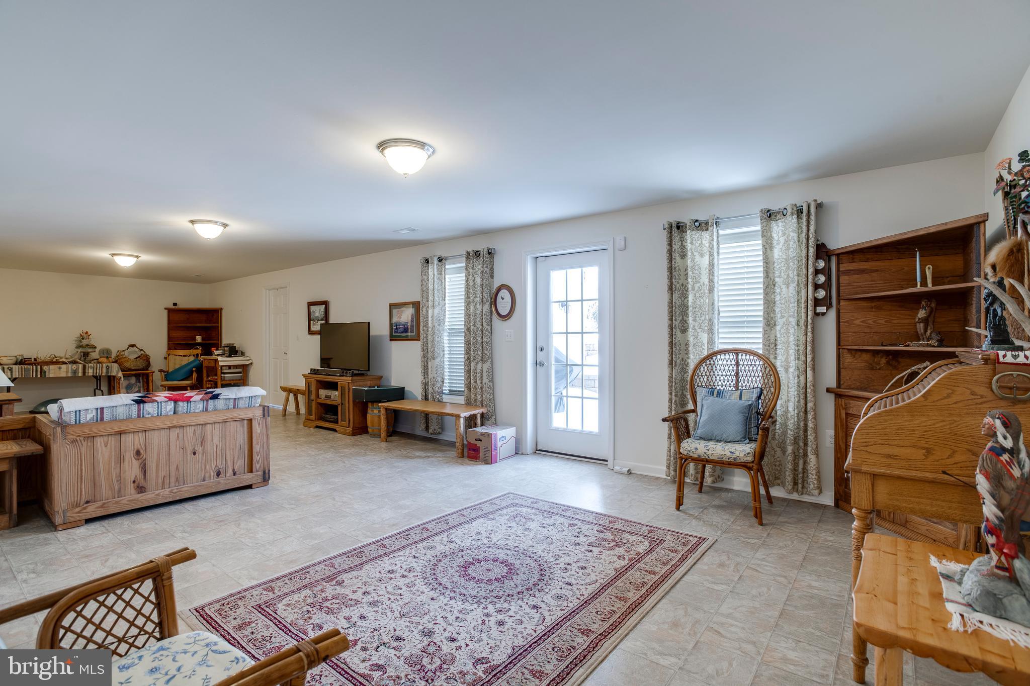 9408 Blackbird Loop Culpeper, VA 22701 - Photo 33 of 89 a living room with furniture and a rug